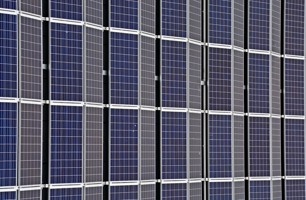 Close-up of multiple solar panels representing renewable energy and sustainability.